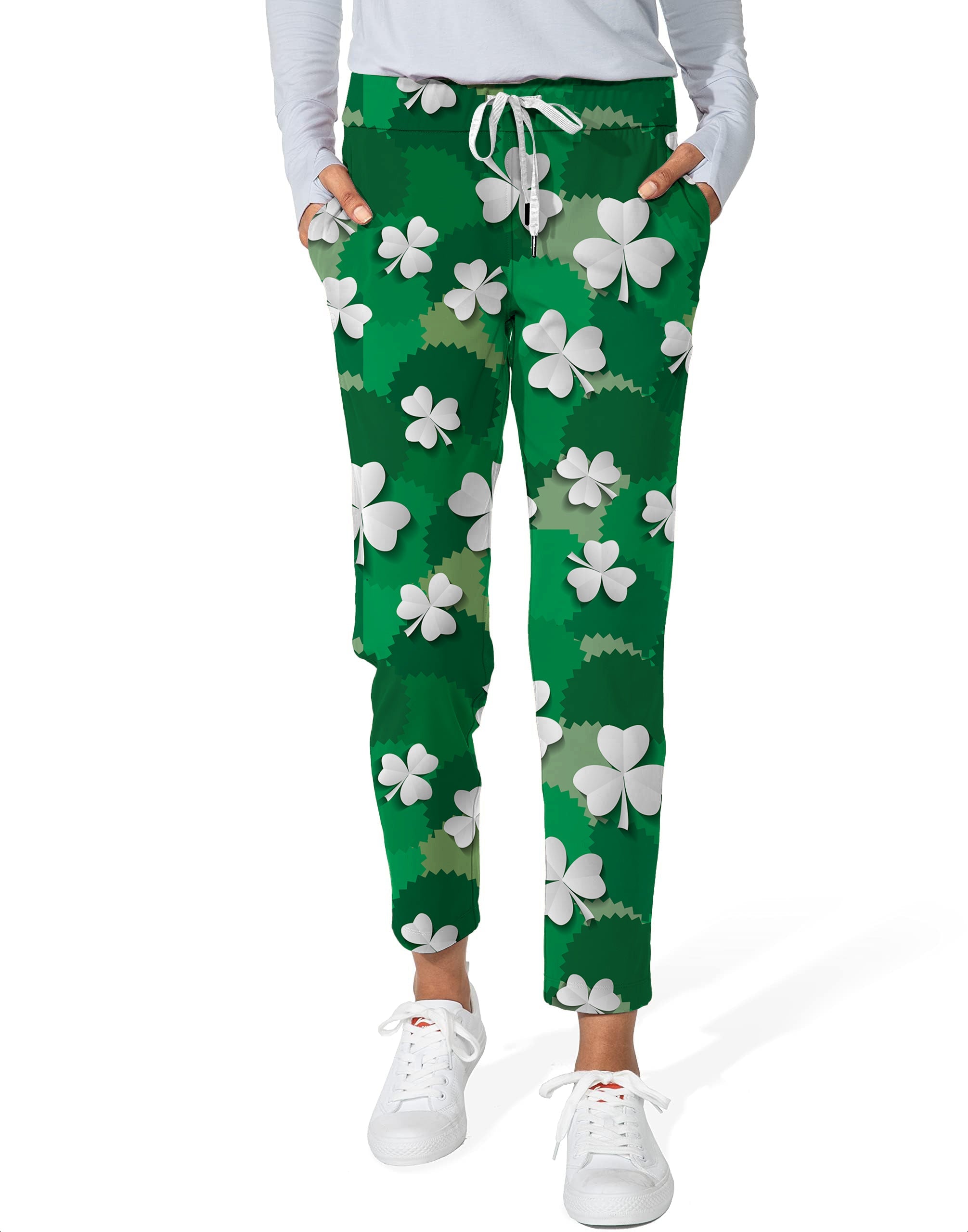Women's 7/8 stretch ankle golf pants with white leaf clover print on green background