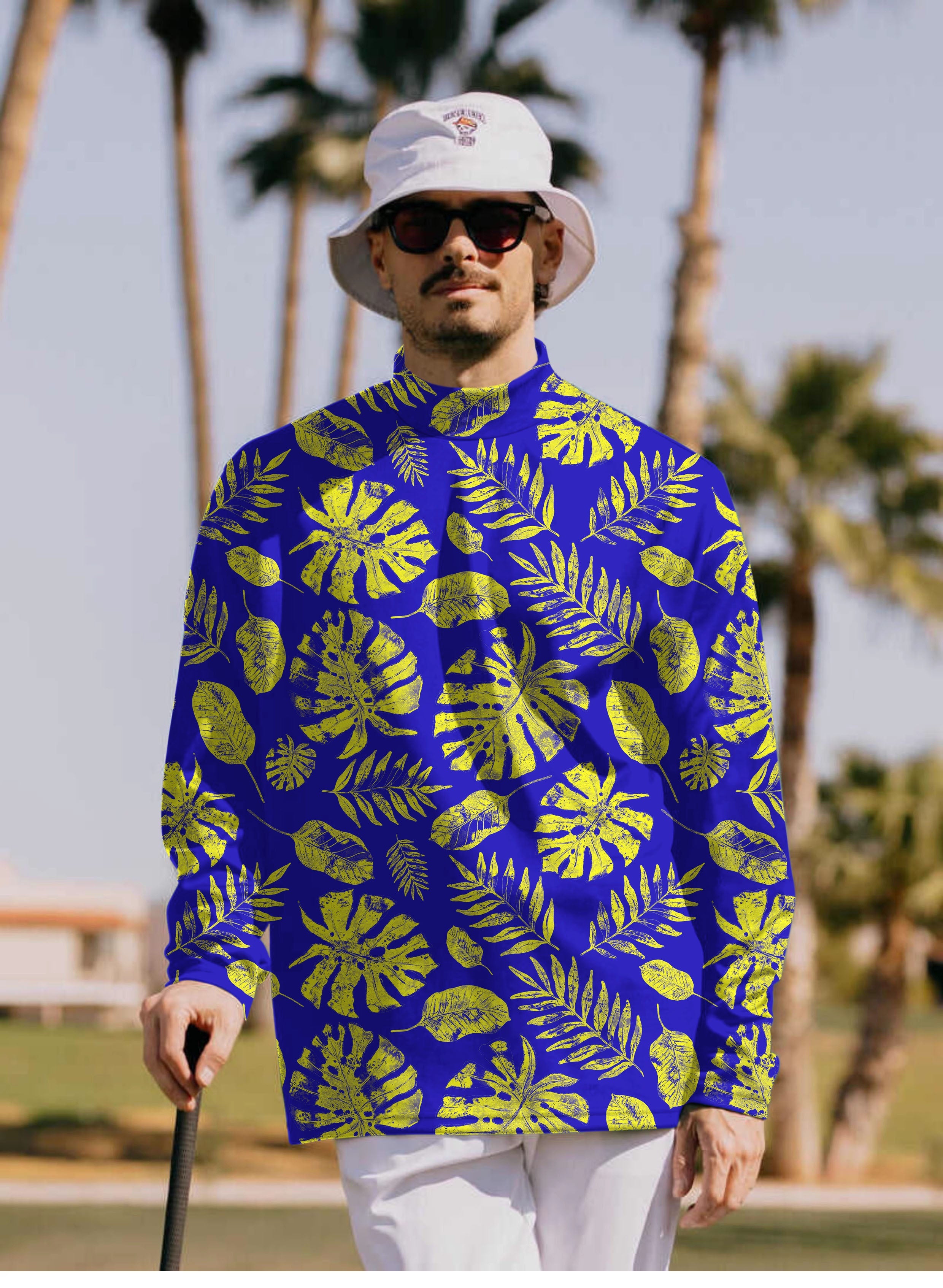 Men's Tropical plants Pullover high neck long sleeve T-shirt with bright green leaf pattern on blue background worn by man outdoors