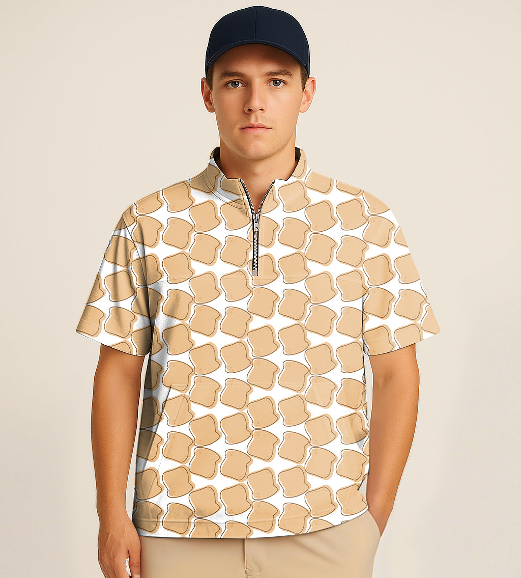Man wearing half zipper turtleneck golf shirt with bread slice pattern and navy cap
