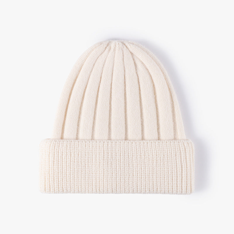 Custom embroidered white knitted winter hat with ribbed texture and cuffed design