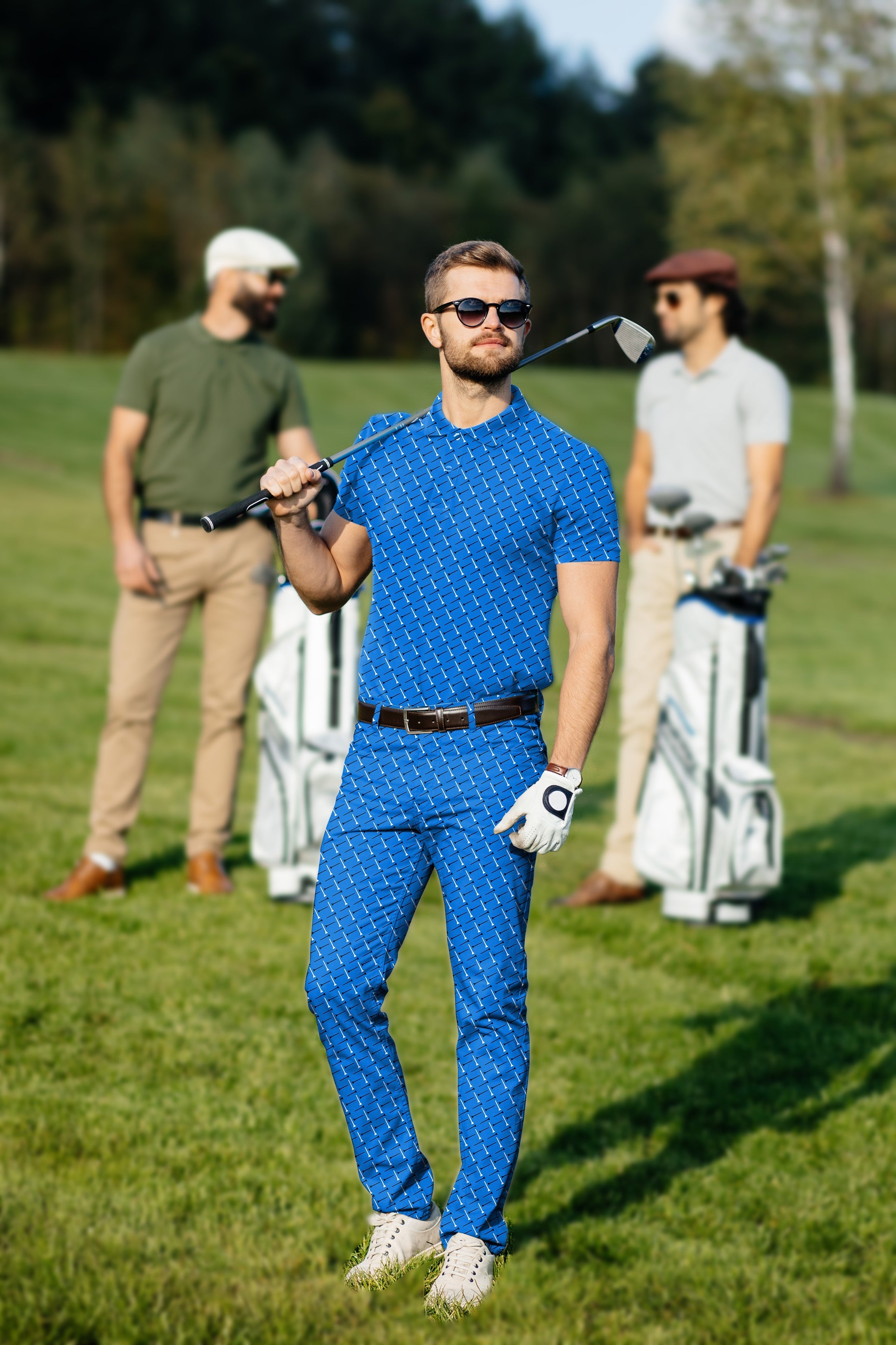 Men's golf set with custom polo and pants in blue patterned fabric on golf course