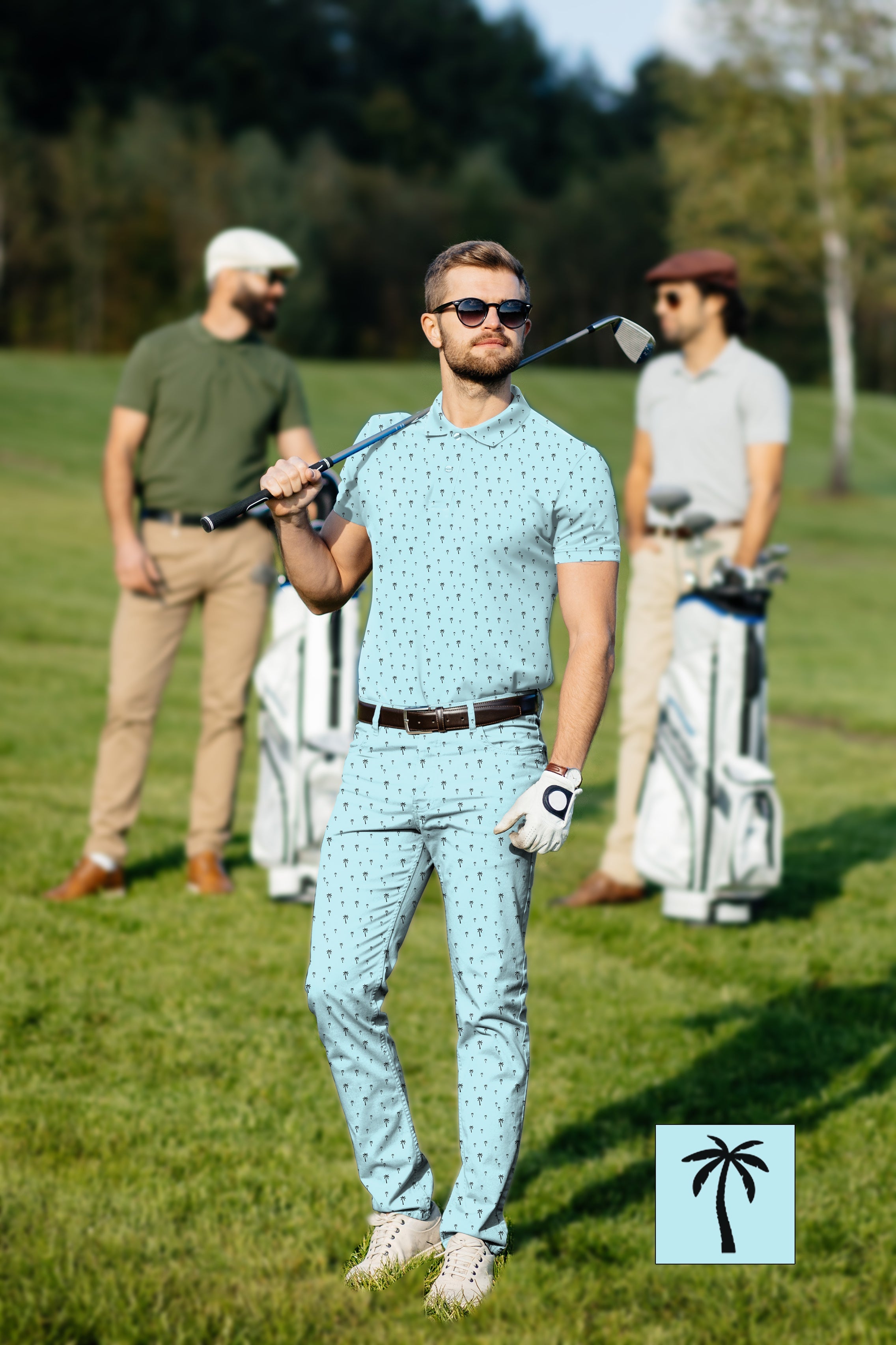 Men's golf set light blue palm print polo and pants on golf course with customizable design and UPF 40+ protection