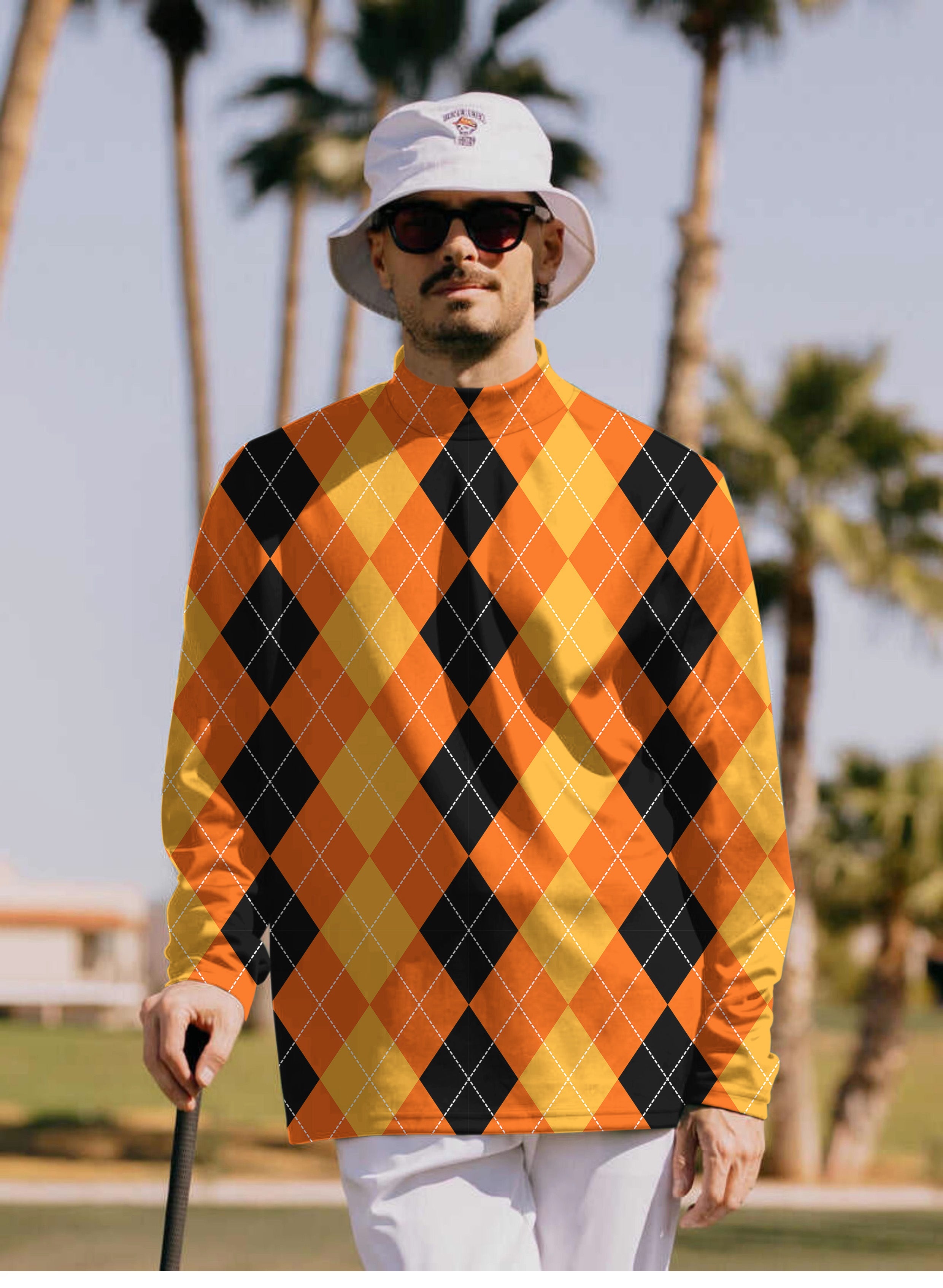 Men's Halloween black yellow orange argyle pullover high neck long sleeve t-shirt on model outdoors