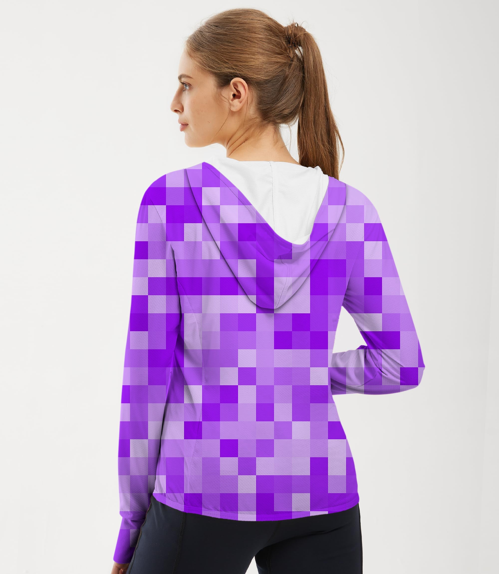 Woman wearing purple pixel pattern slim fit golf hoodie with sun protection and thumb holes