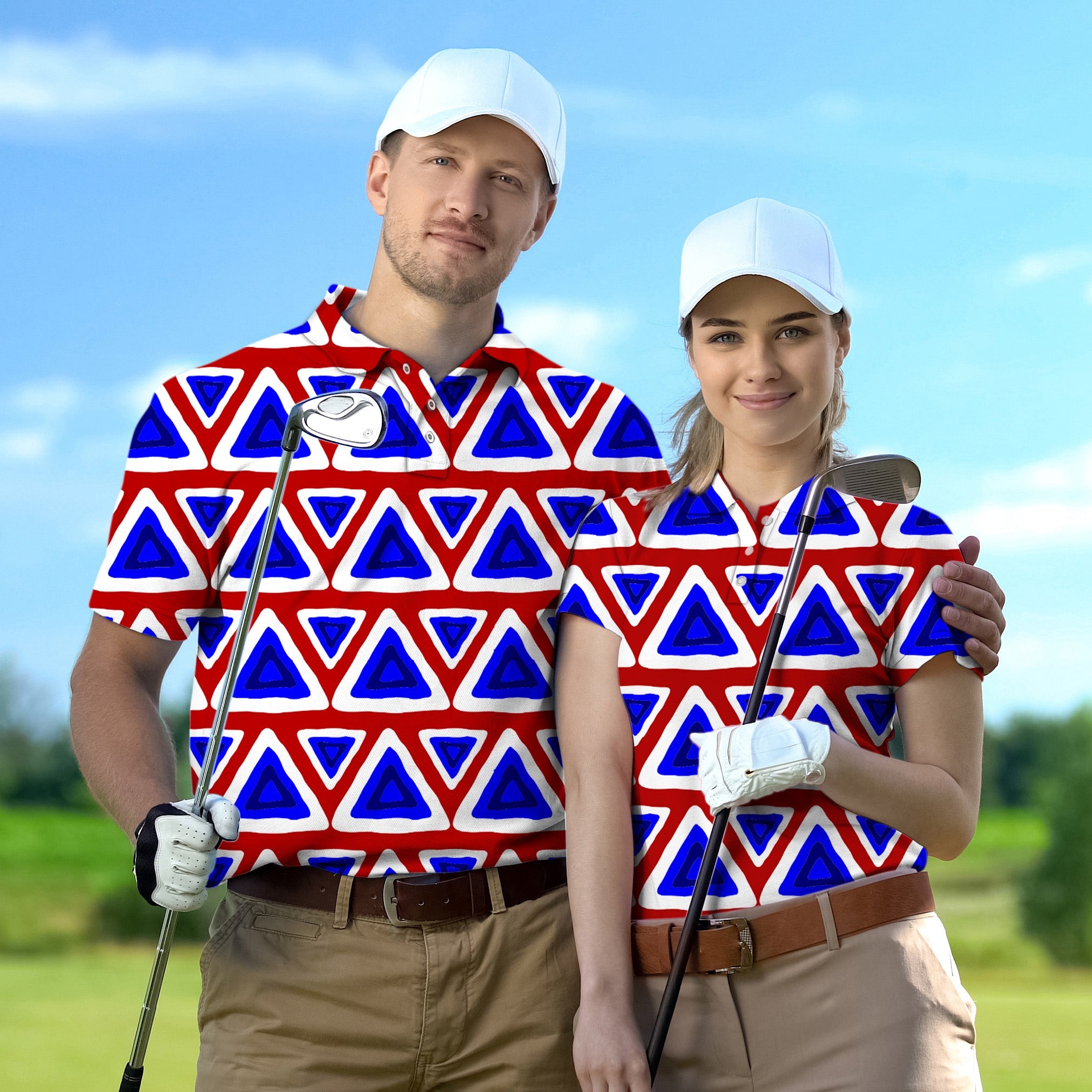 Couple wearing matching red, white, and blue triangle tribal pattern golf shirts with caps on golf course