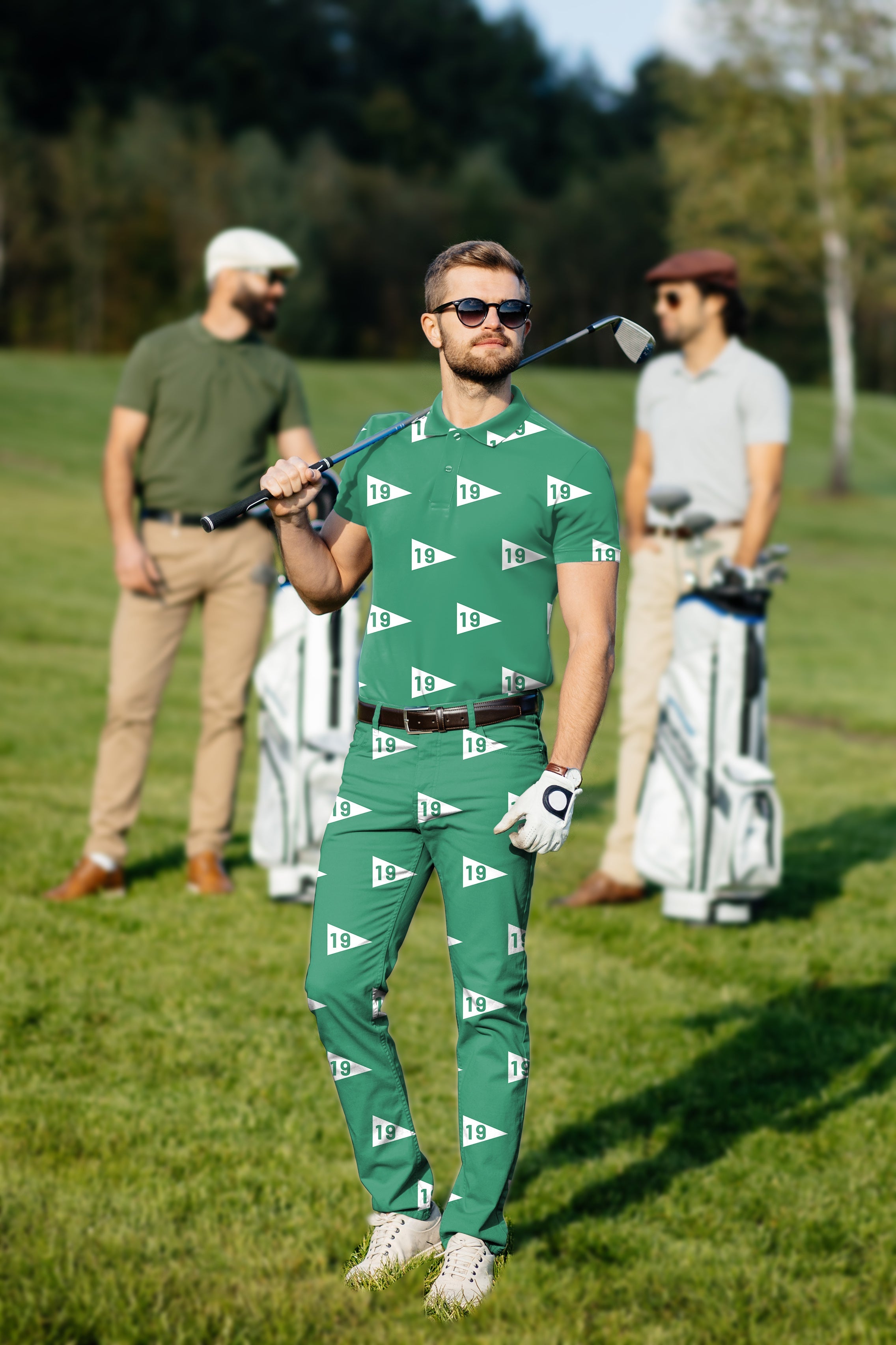 Men's golf set polo and pants with custom logo print on golf course, styled for comfort and classic fit