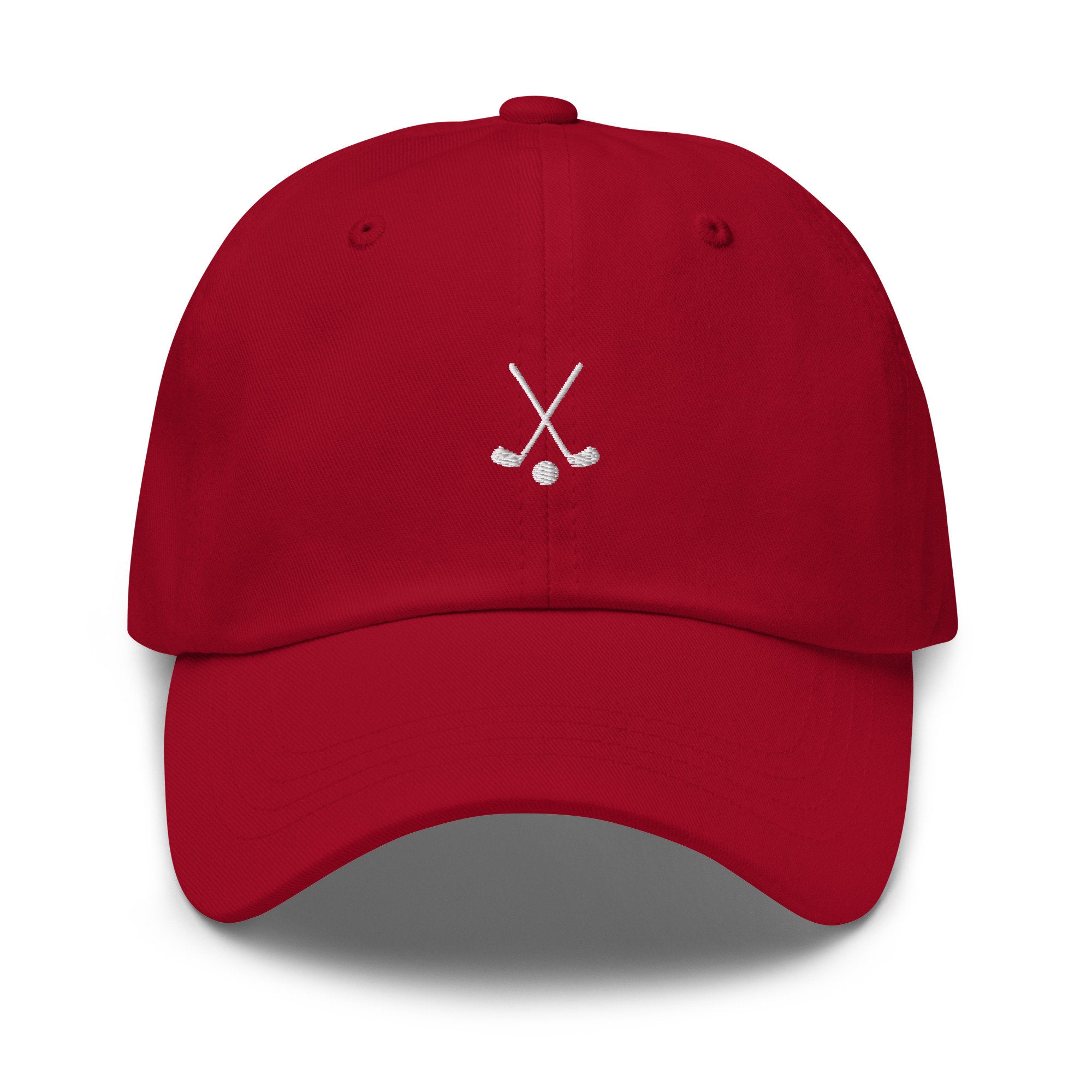 Custom embroidered red golf hat with crossed golf clubs design and adjustable snapback fit