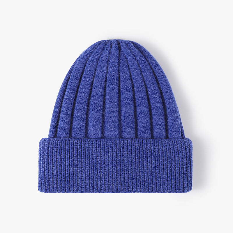Blue knitted winter hat with ribbed texture and fold-over cuff custom embroidered hats