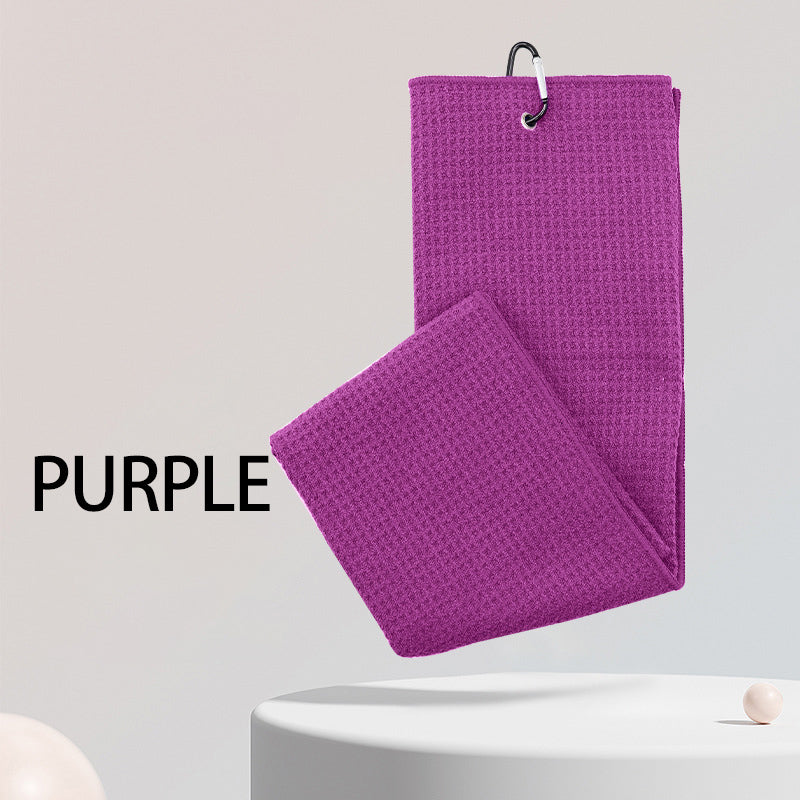 Purple sports microfiber waffle golf towel with custom embroidered logo and a hole for golf clubs.