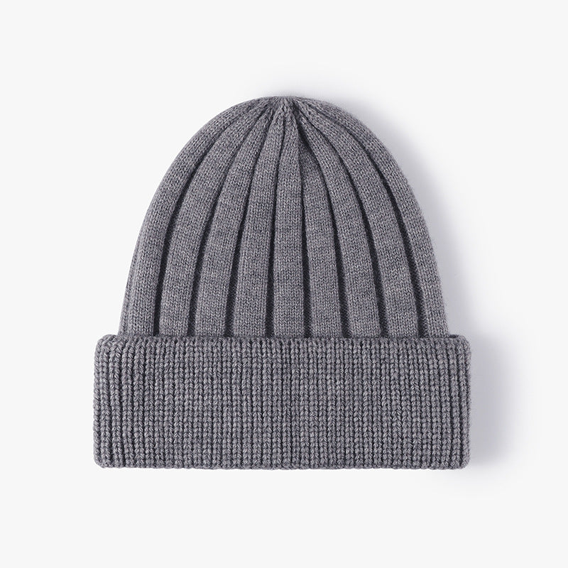 Custom embroidered gray knitted winter hat with ribbed design and folded cuff, unisex adjustable fit for adults.