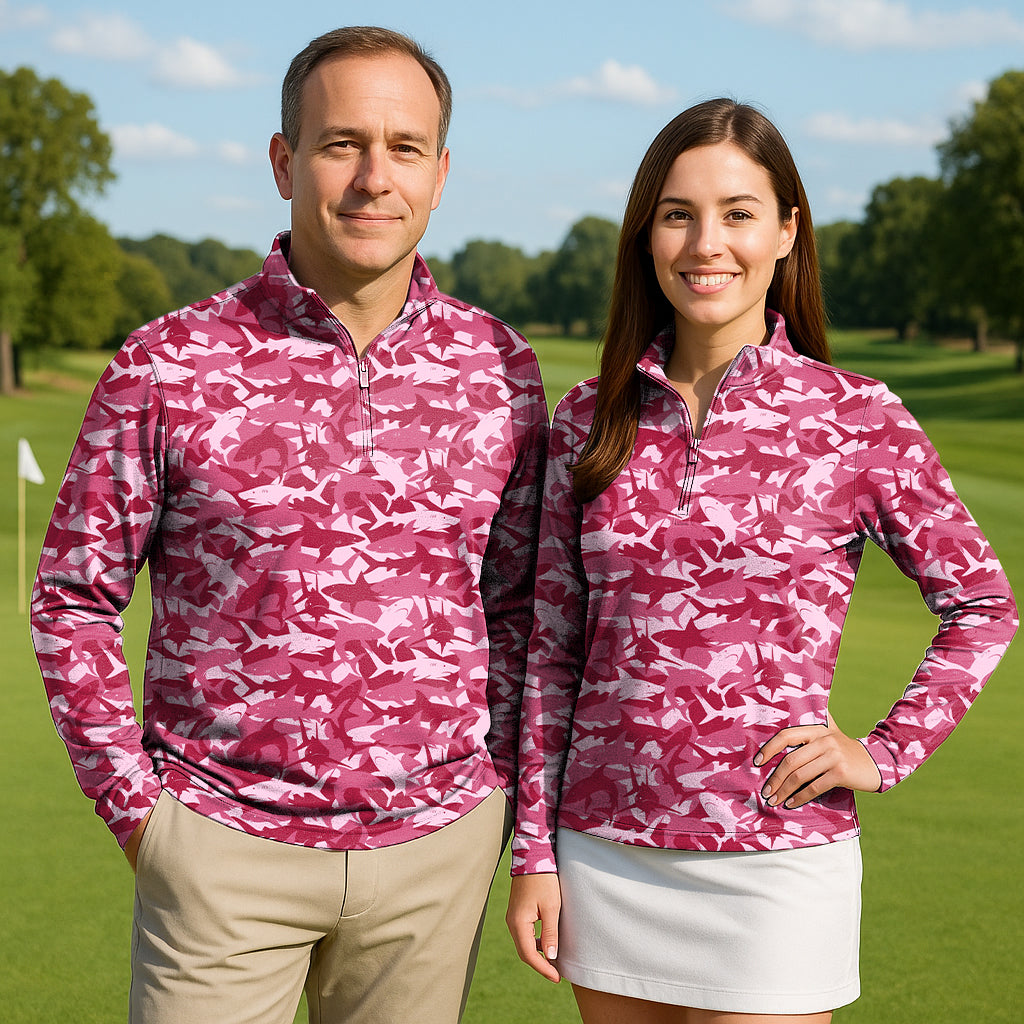 Couple wearing Bait In The Water pink camo golf active 3/4 zip tops on golf course