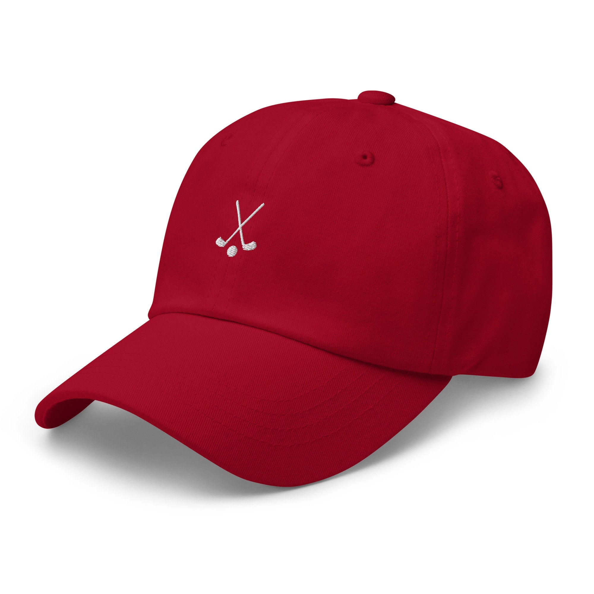 Custom embroidered red golf dad hat with crossed golf clubs design and adjustable snapback closure