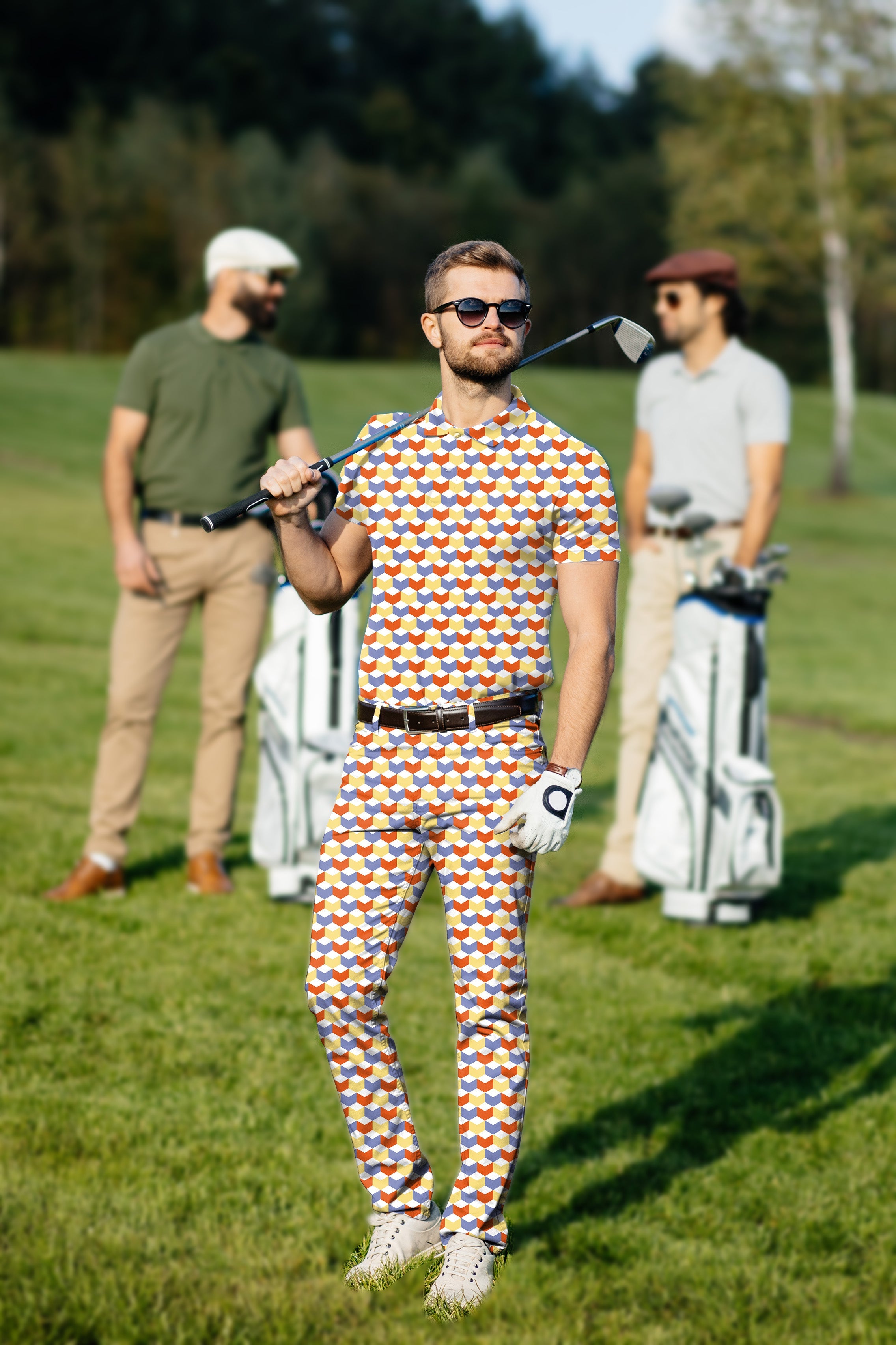 Men's golf set with colorful 3D square pattern polo and pants on golfer at course